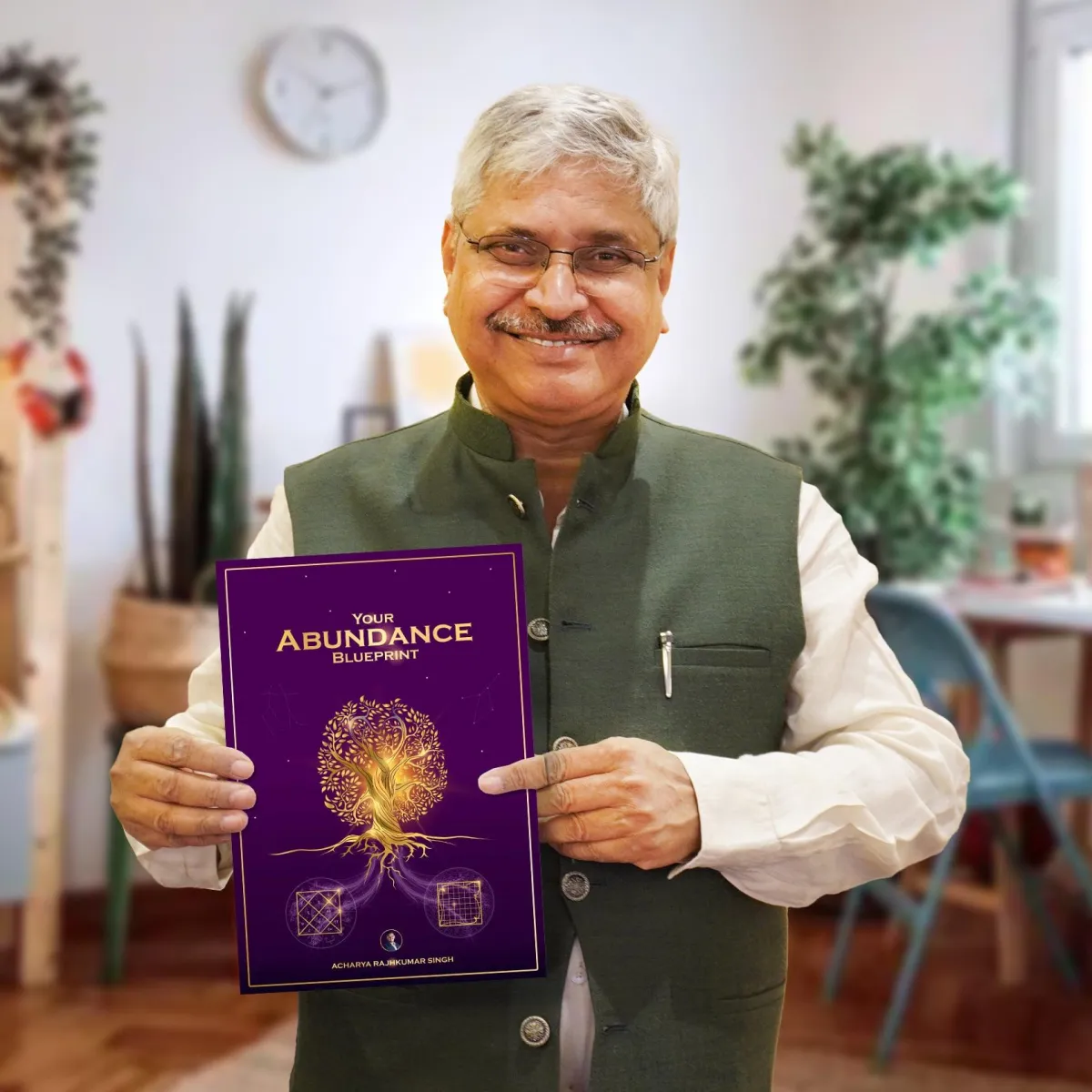 AK Sinha holding Your Abundance Blueprint
